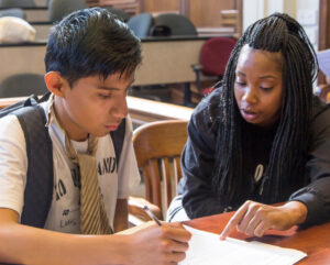 Woman teaching a teenager