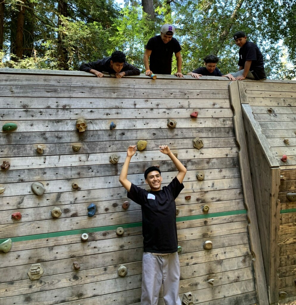 Kids at a rock climbing wall