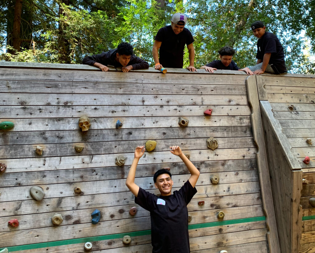 Kids at a rock climbing wall