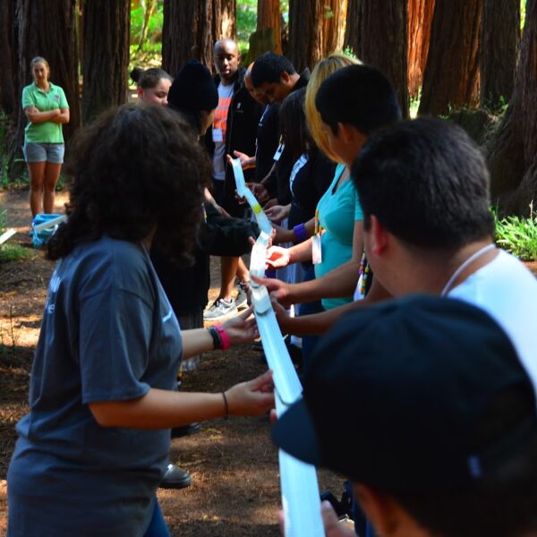 Group of people playing tug of war