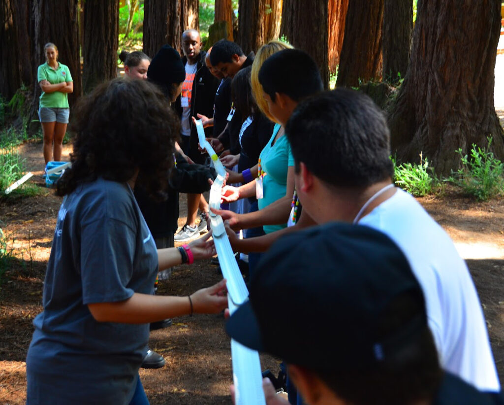 Group of people playing tug of war