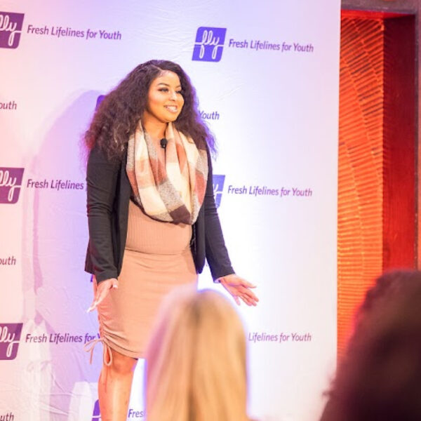 Young woman speaking to a crowd